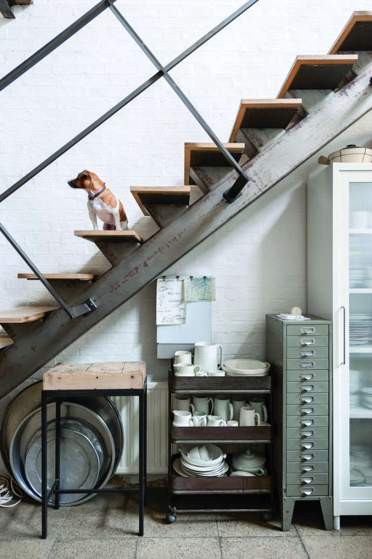 A single, narrow file cabinet occupies the under-stairs space in the kitchen of chef and shop owner Alastair Hendy. Photograph by Matthew Williams for Remodelista. See the full setup, scullery included, in our post Revolution Road: A Ground-Breaking Kitchen in London.