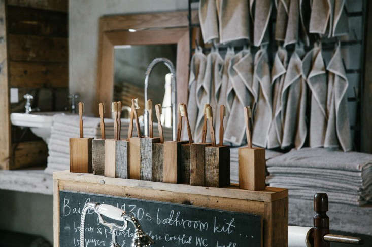 A display of oak block toothbrush holders.