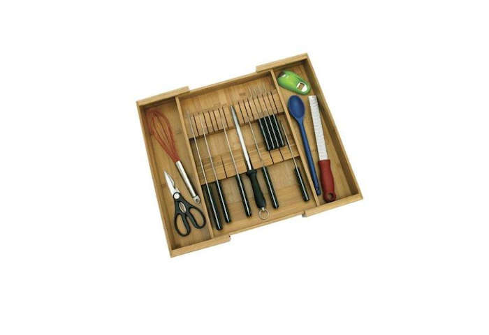 The Bamboo Expandable Knife Organizer by Lipper International stores kitchen knives and utensils; $12.37 from Amazon. For flatware drawers, see our previous post: Drawer Divider Roundup, which includes a vertical storage solution for the space pressed.