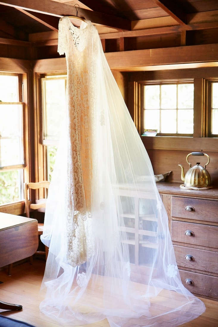 Wedding gowns are often composed of many materials, each of which requires different care. Pictured is interior designer Faye McAuliffe’s lace gown by Ivy & Aster and dramatic veil, borrowed from the mother of the groom. For more on her wedding, see The DIY Wedding: An LA Designer’s Boathouse Nuptials.