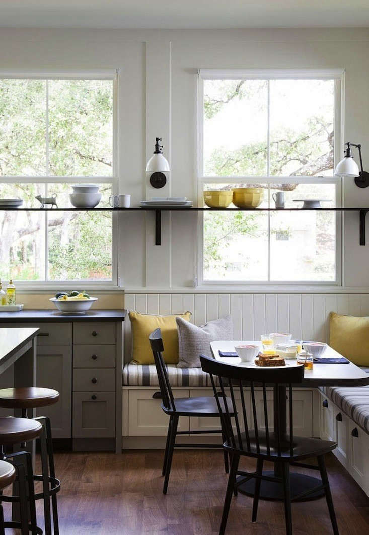 This modern farmhouse kitchen with built-in bench drawers was designed by Tim Cuppett Architect of Austin.