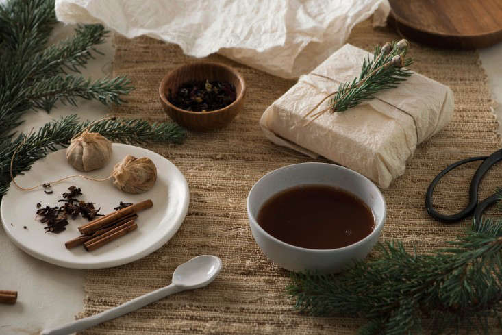 A new twist on the brown paper package tied up with string: Simone’s tea-dyed gift wrap surrounded by the ingredients for making it.