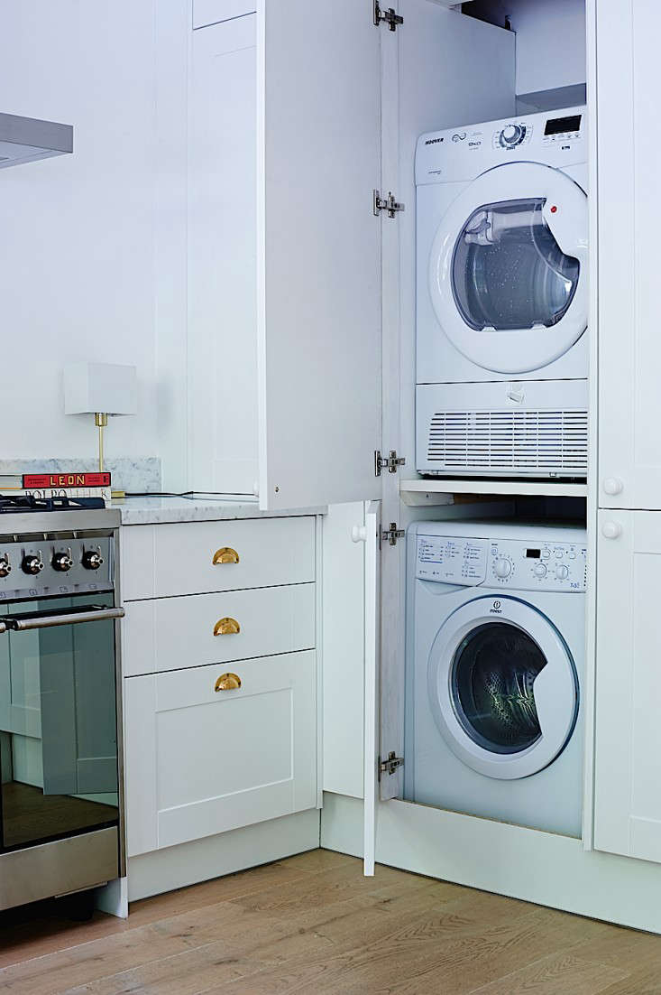  Without a utility room in which to hide the boiler and washer/dryer, the homeowners had to steal space from the kitchen. Photograph by Jonathan Gooch for Remodelista, from Rehab Diary, Part 3: A Small House Overhaul in London, the Big Reveal.