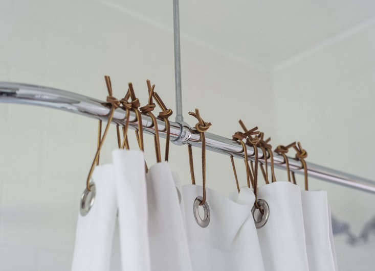 Sarah puts leather lace to all sorts of uses, from napkin ties to Shower Curtain Rings (to replace the plastic ones in her guest bath). Read her 10 Tips for How to Transform a Rental Bath and see the rest of her house in Sarah’s Refined Rental.