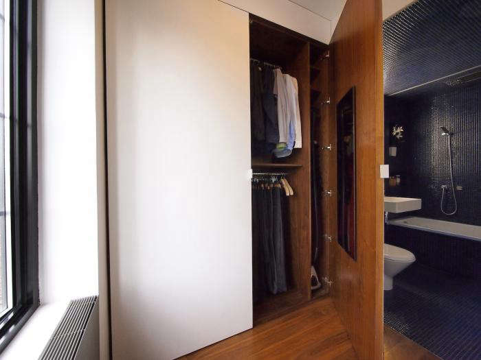 Also from Rosa and Robert Garneau of Studio Garneau: a simple, streamlined closet with a mirror mounted inside each door. Photograph from The Architect Is In: A Tiny Live/Work Loft Made Large.