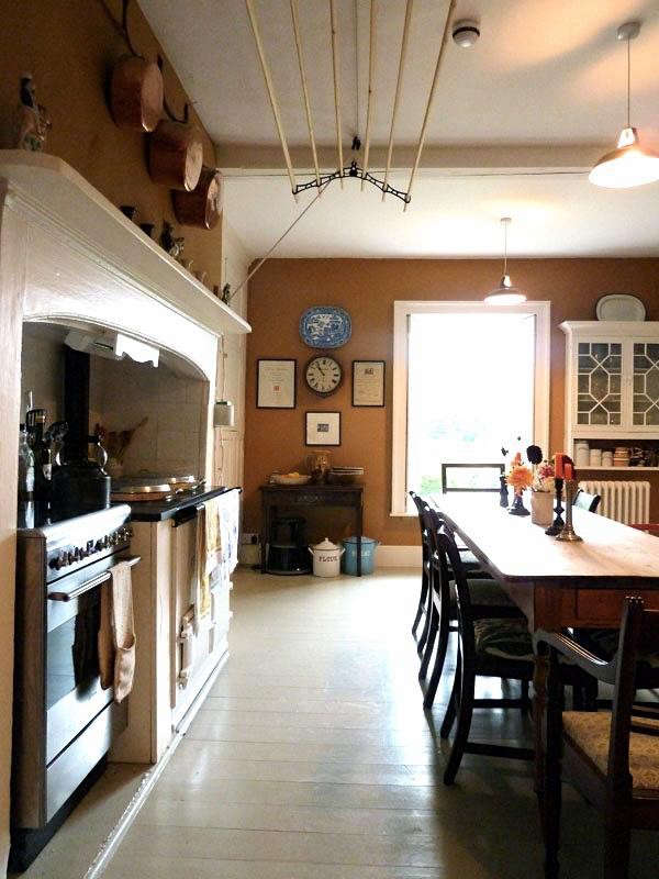 An extra-wide clothes airer in designer Ben Pentreath‘s Dorset kitchen, hoisted, as is traditional, above the range, where the air is warmest.