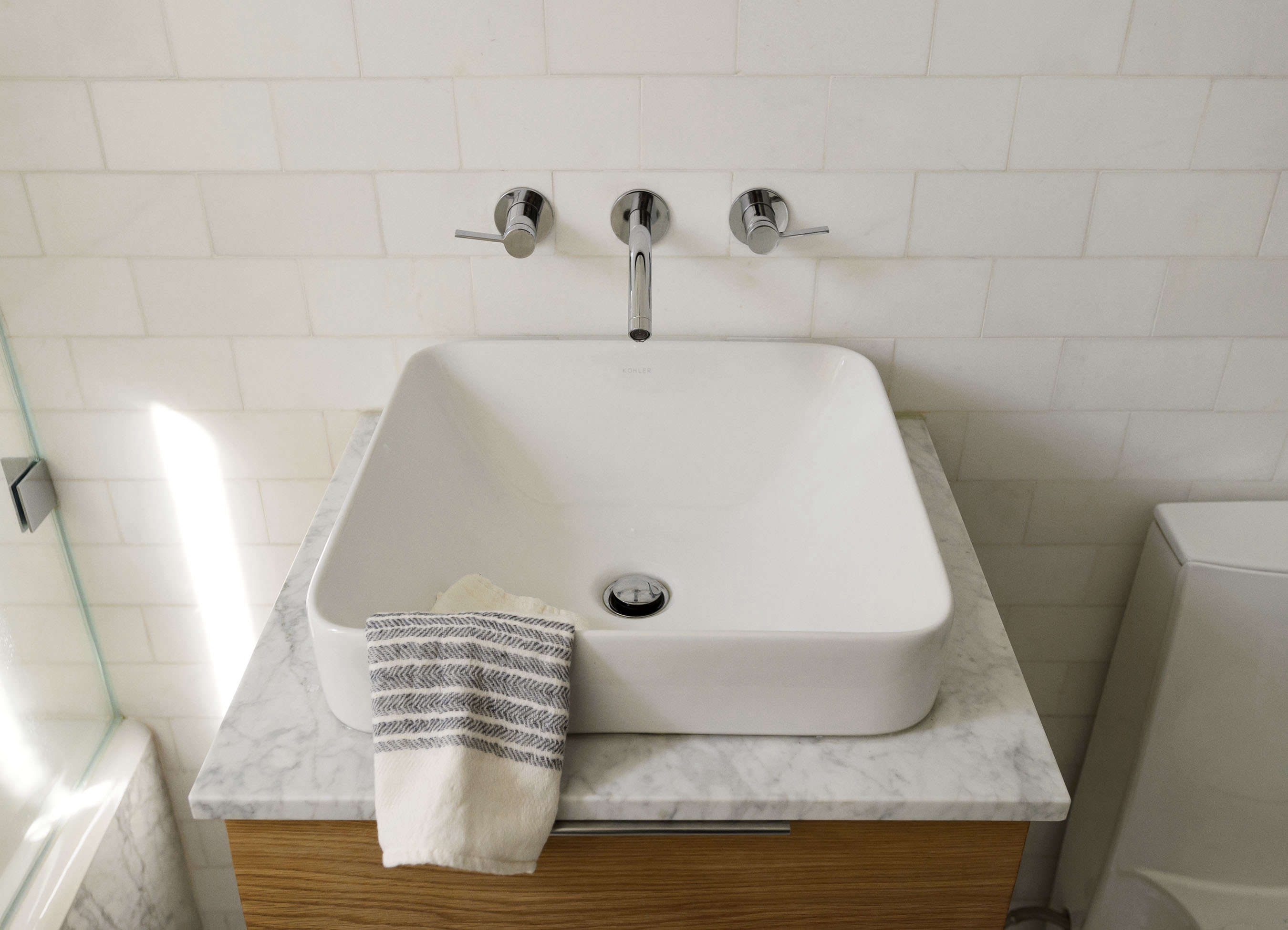 Square bathroom sink in Jacqueline-Schmidt and David Friedlander's 675-square-foot Brooklyn quarters, Matthew-Williams-photo | Remodelista