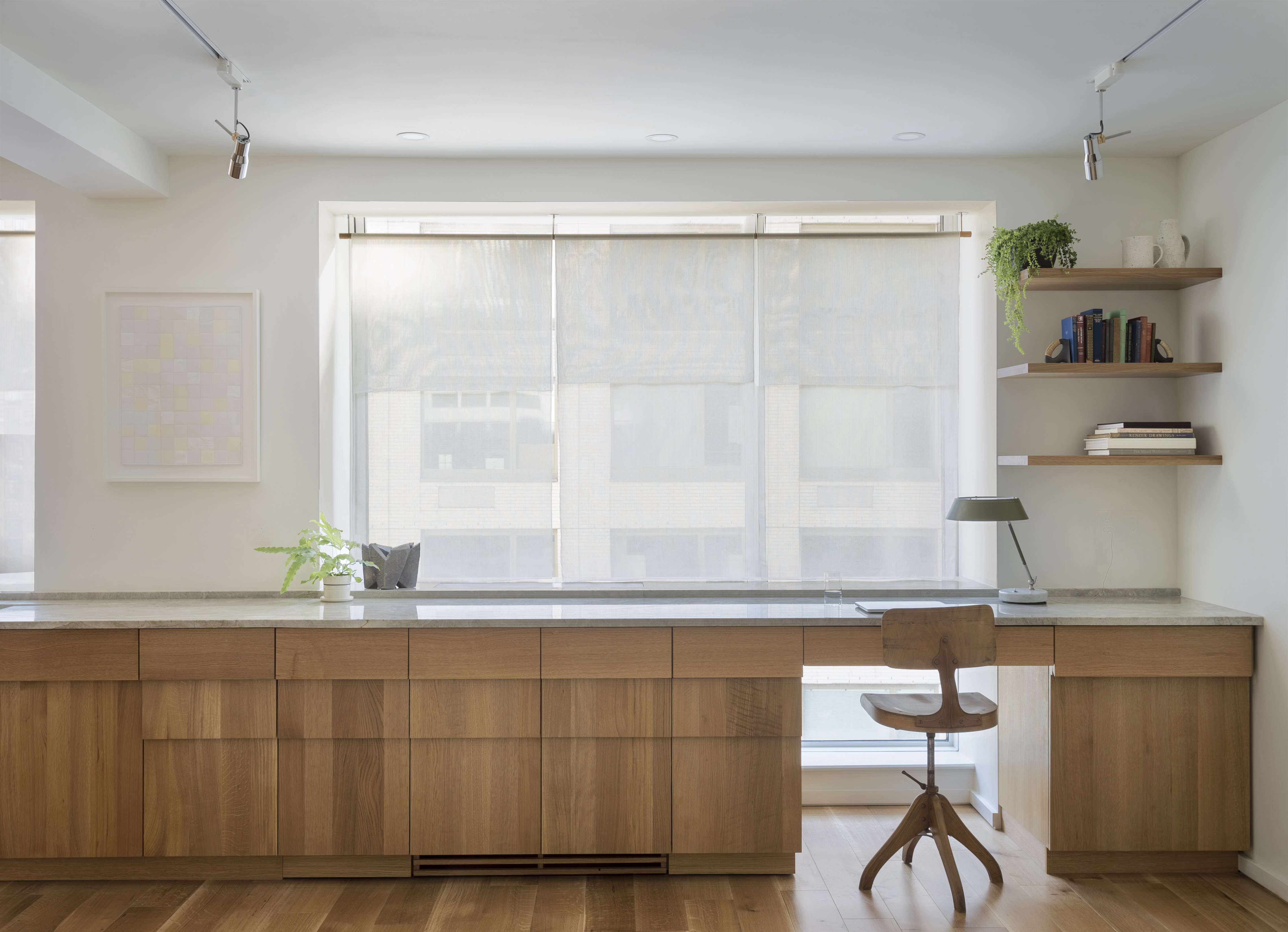 New York apartment home office with custom stepped oak cabinets, a design by Workstead , Matthew Williams photo