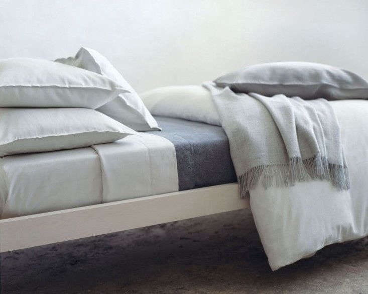 A clean, crisp bed made with Area Home sheets.