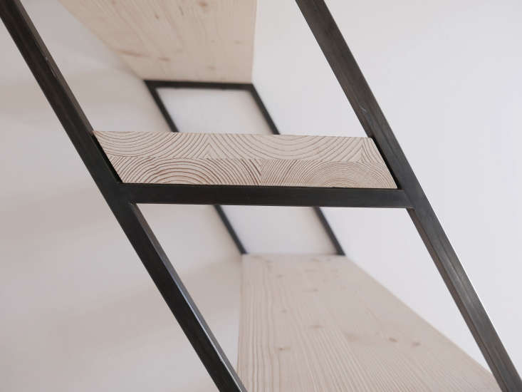 The stairs to the sleeping loft are made of unfinished pine.