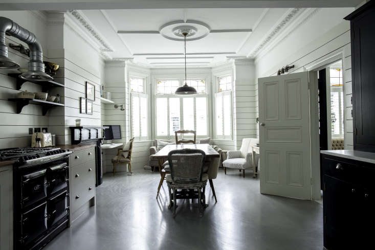 British Standard kitchen with shiplap paneling and bay window