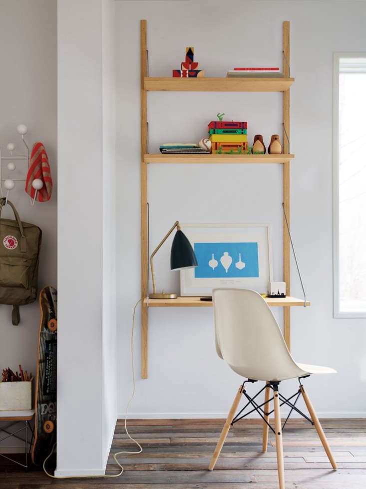 The soaped oak with raw brass Royal System Shelving Unit is $1,670 from Design Within Reach.