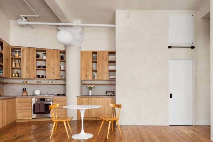 Kitchen of a Gramercy Park apartment remodel with plaster walls and oak cabinets