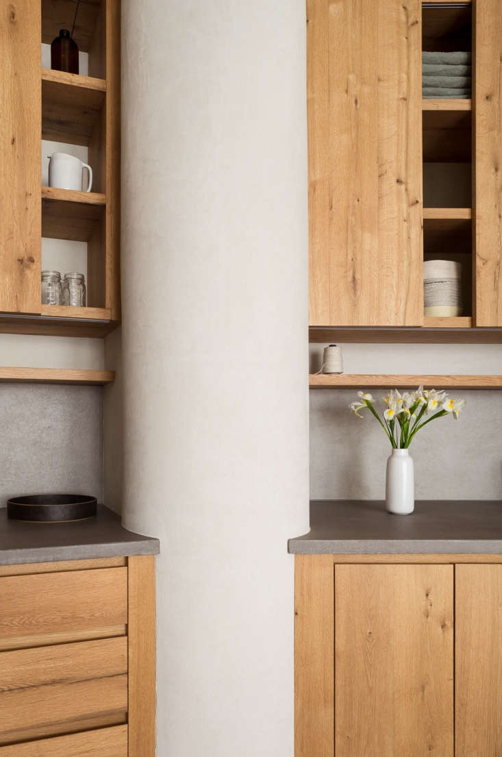 Kitchen of a Gramercy Park apartment remodel with plaster walls and oak cabinets