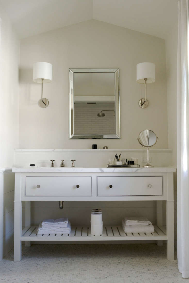 The vanity countertop in the master bathroom is statuary marble. The faucet is from Lefroy Brooks.