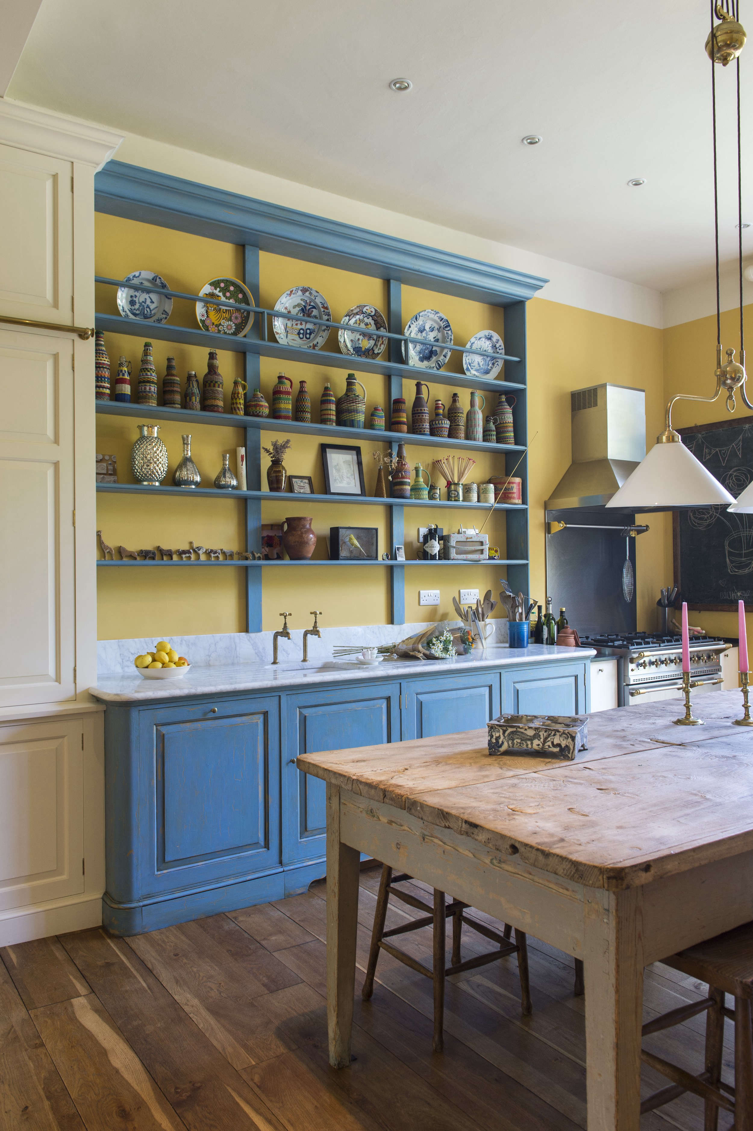 Max Rolitt UK Colorful Kitchen with Wood Table and Blue Cabinets