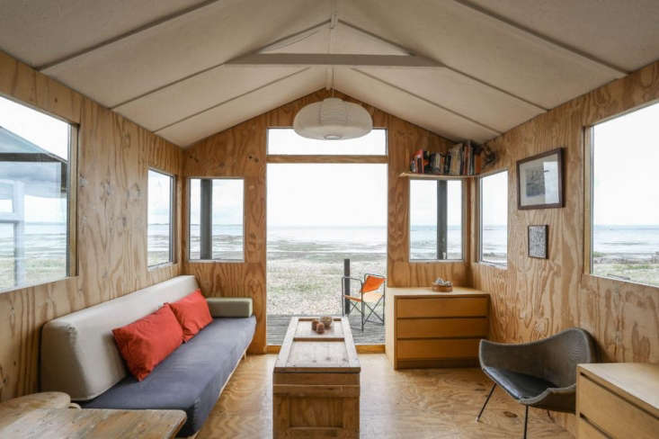 Tiny plywood-lined beach house in Seasalter, England, Marcia Mihotich and Durrell Bishop. Photo via The Modern House.