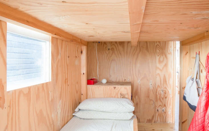 Plywood bedroom with sleeping loft in Marcia Mihotich and Durrell Bishop's tiny beach house, Seasalter, England. Marcia Mihotich photo.