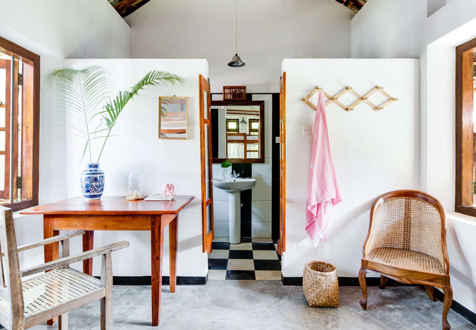 Guest quarters with black-and-white tiled bath at Sunshine Stories, a surf and yoga retreat in Sri Lanka. Mitchell Fong photo via Indoek.