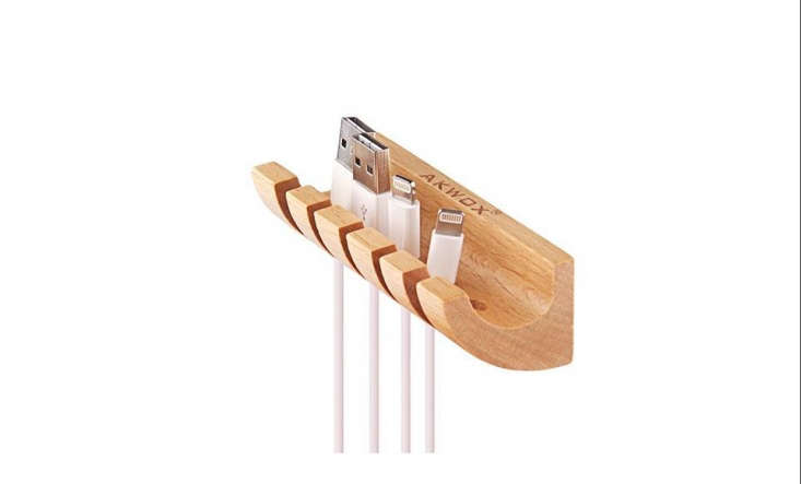 This Wooden Cable Organizer and Cord Management System from Akwox has five slots for cables and mounts onto a desk horizontally or vertically using provided double-sided tape; $9.99.