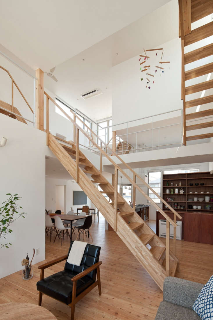 Wood staircase in shared living room of LT Josai co-living space in Nagoya