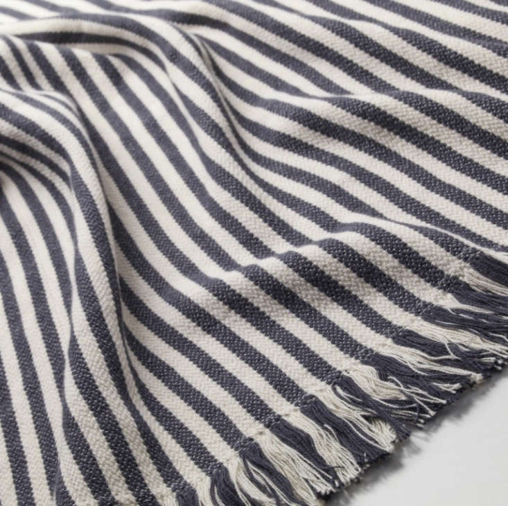 Another winner in Ikea’s lineup of affordable throws (we miss the now-retired Backvial): The Tuvalie 100 percent cotton throw is available in dark gray or red stripe; $12.99.