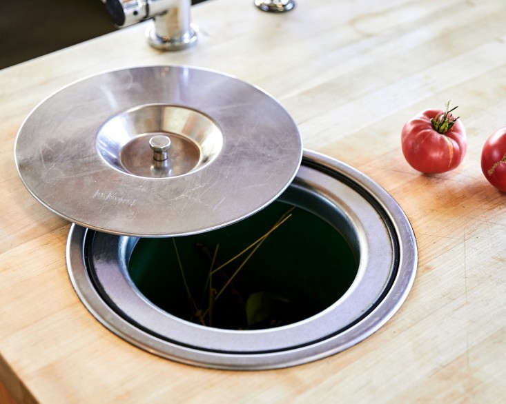 Food waste can go directly from the countertop cutting board into the pail. Photograph by Daniel Dent for Remodelista.