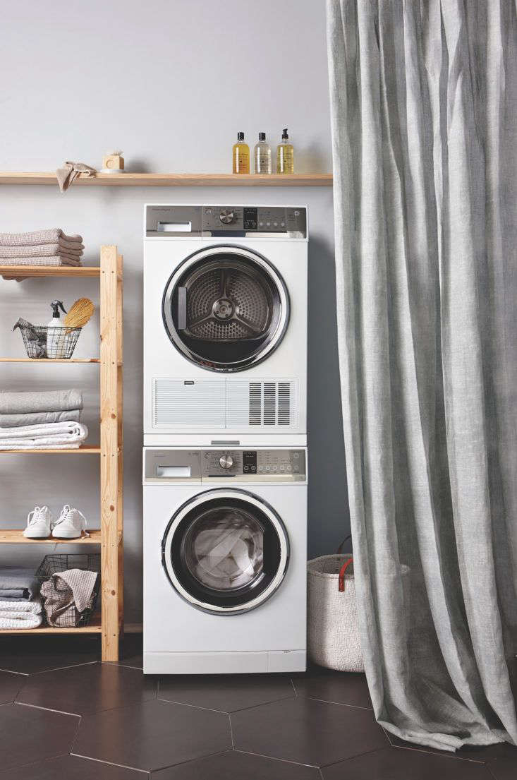 Curtained laundry by Homestyle magazine, New Zealand. Fisher-Paykel stacking washer-dryer.