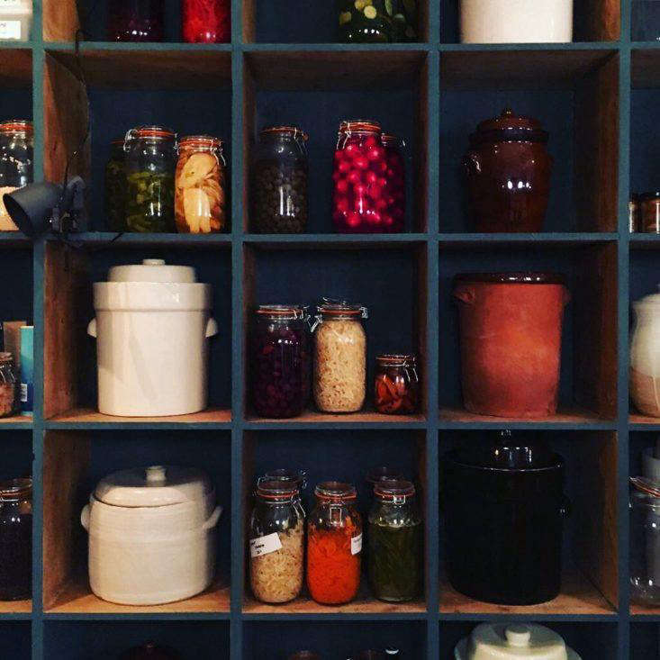 “These shelves are made from old pine cheese boards from Holland,” explains Lattin, who found them at the Ardingly International Antiques & Collectables Fair and then waxed and painted them.