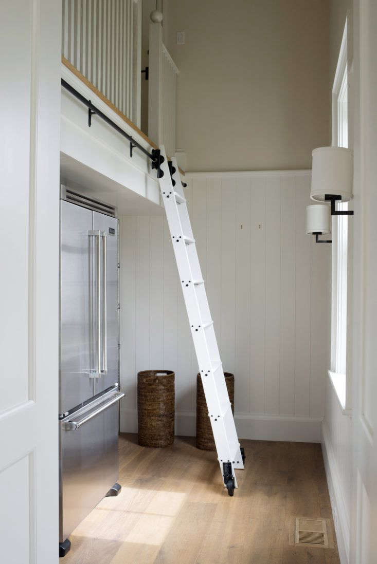 A rolling ladder inside Barbara’s kitchen pantry is not for reaching overflow dry goods; rather, it leads to a guest bedroom that can be accessed both from the pantry and from outside. It’s sited away from the daily circulation paths, but is there when Barbara’s kids and their children come to visit.