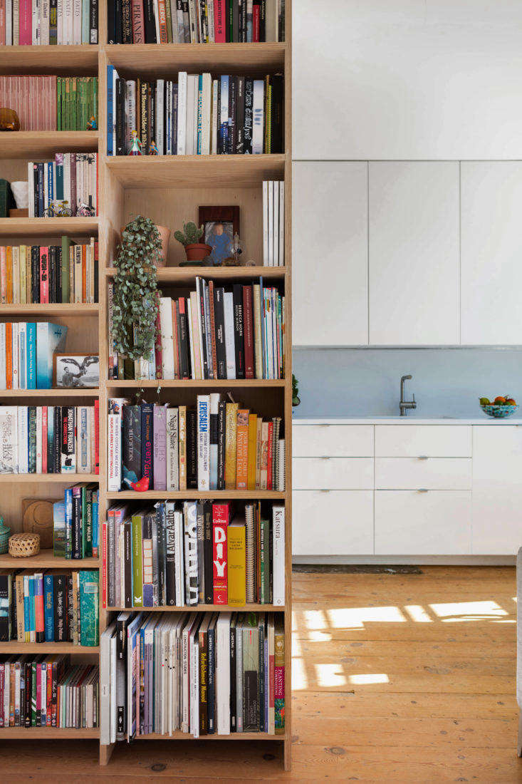 Built-in wood bookcase in London remodeled apartment