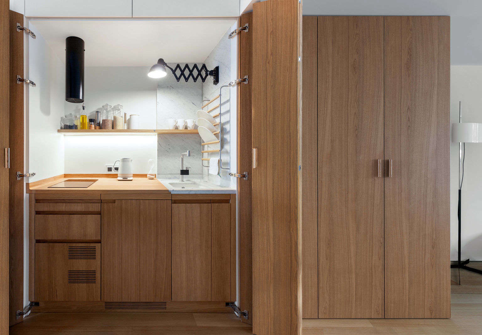 The Kitchen In This Small Apartment Is Hidden In A Closet