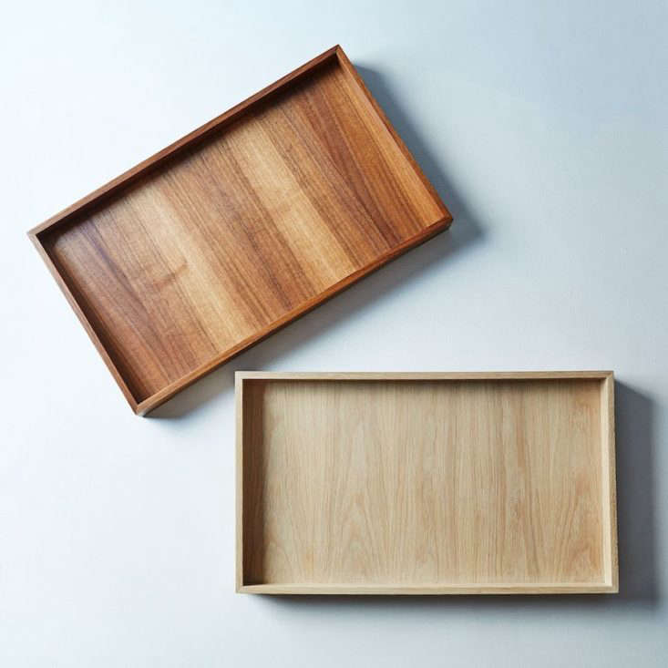 Above: The Handmade Wooden Brass Tray by Cliff Spencer for Alasaw comes in walnut or oak with brass details; $350 from Food 52.