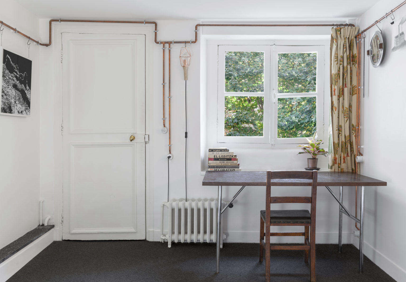 Living Area with Copper Pipes in Shaker Studio Airbnb in Paris by Ariel Claudet, Photo by Cyrille Lallement