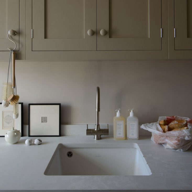 An elegant setup. Hanging the scrubbing brushes from an S hook right next to the kitchen sink not only makes sense but also provides a great way to air-dry them. Why keep the brushes hidden away when they can be so pretty to look at? Another option: Hang a nice-looking dish towel from a hook.