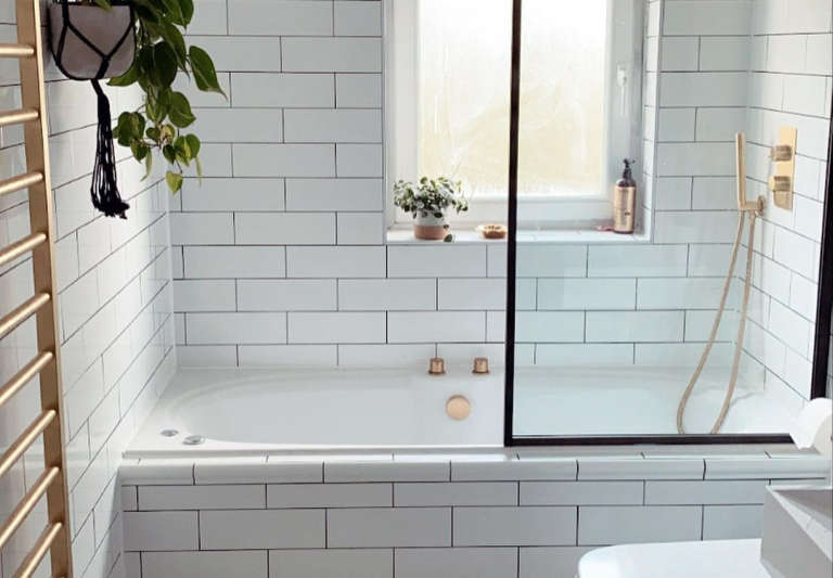 Ferren Gipson's white-tiled bathroom remodel, London.