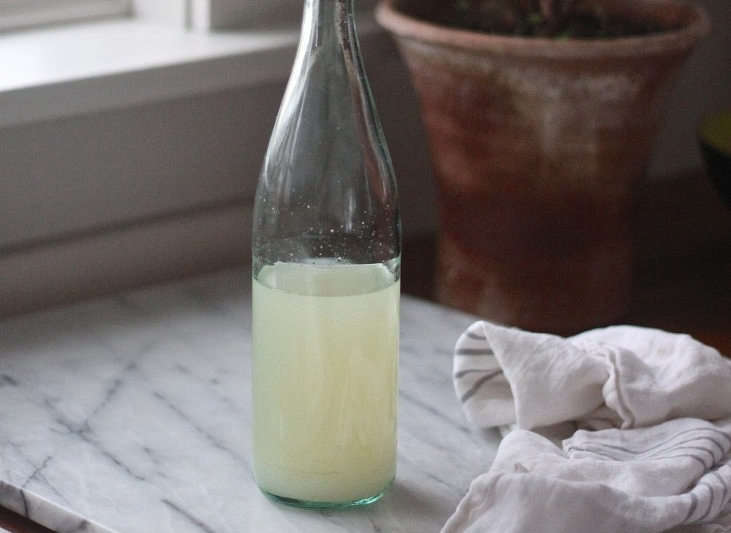 Searching for an eco-conscious alternative to traditional detergent-based dish soap? Look no further than this easy, inexpensive DIY natural dish soap, comprised of only a few simple ingredients. Photo by Justine Hand.