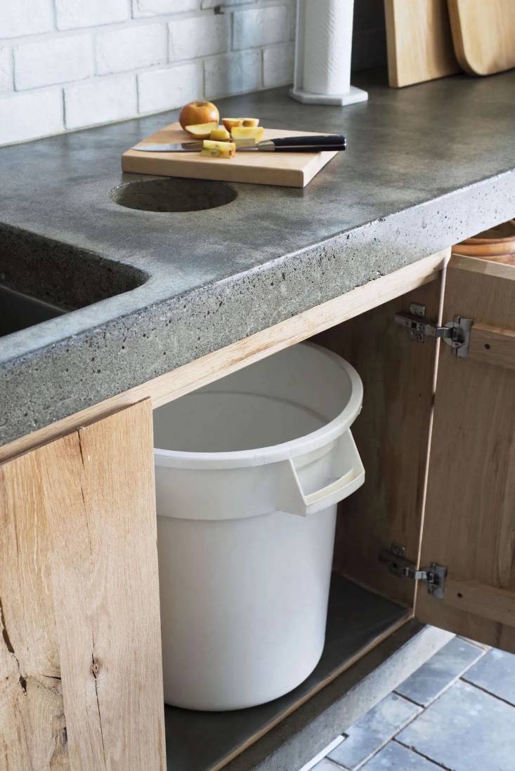 In the kitchen of Scribe Winery’s Sonoma hacienda, a compost chute is built into the concrete countertops, with the bin being hidden by rustic doors. Read more on this kitchen in Kitchen of the Week: A Hacienda Kitchen in Sonoma’s Hippest Winery. Photograph by Andres Gonzalez.